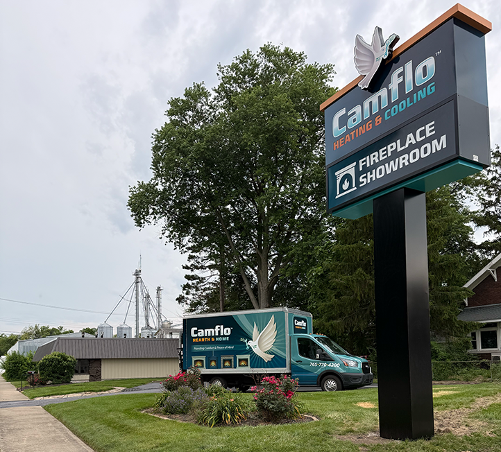 A sign for the Camflo Heating & Cooling Fireplace Showroom in Monticello, Indiana.
