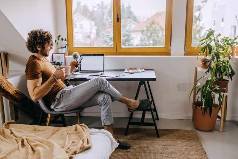 Image of someone sitting at desk. Conventional HVAC or a Heat Pump: Which Is Better?