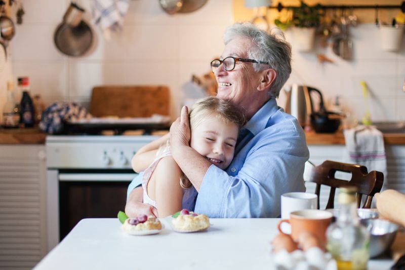 Why Do I Need a Humidifier in the Fall? - Grandma holding her granddaughter.